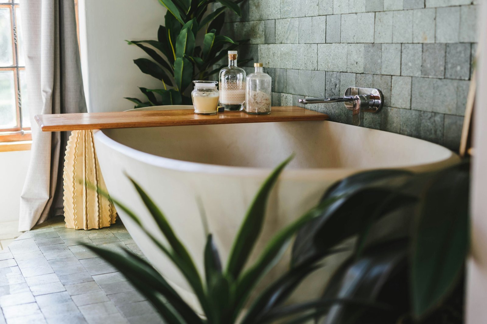 Modern bathroom shelf with multiple humidity-loving plants arranged together