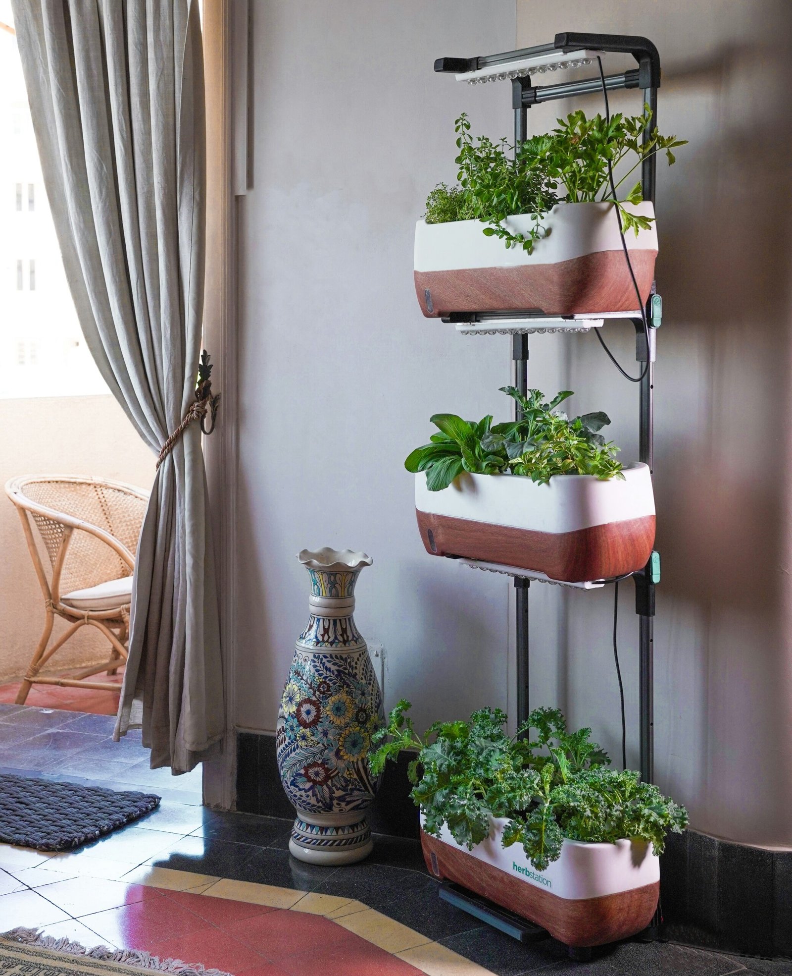 Two styles of tiered vertical planters with vegetables growing on a patio