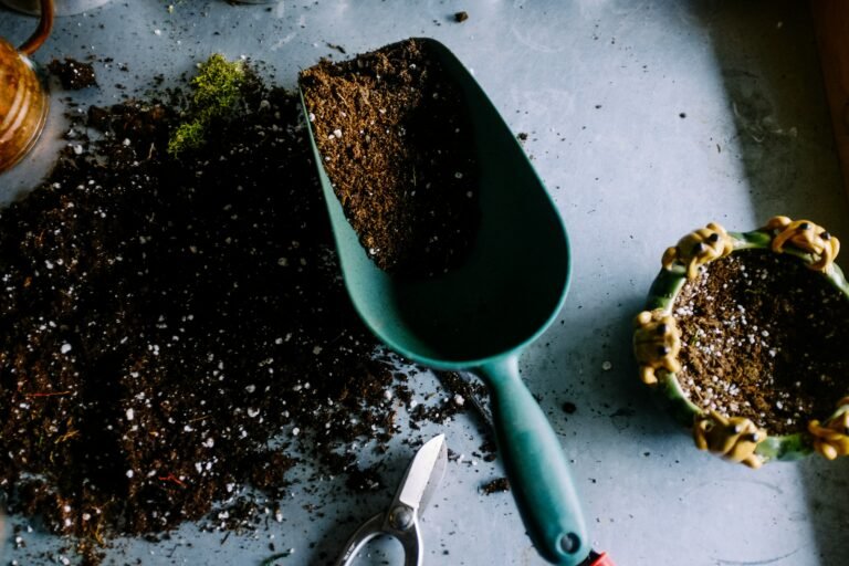 Hands mixing potting soil, perlite, and coco coir in a large tub on a balcony